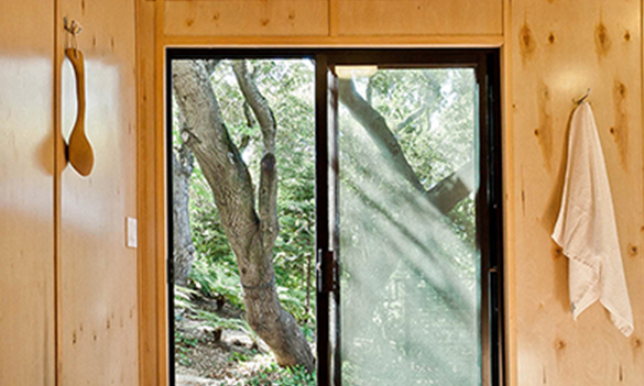 Interior wood-paneled shed with sliding glass door