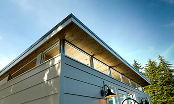 Prefab shed with clerestory windows and sloped roof