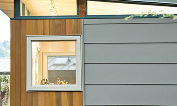 Modern shed exterior with mixed siding and window detail